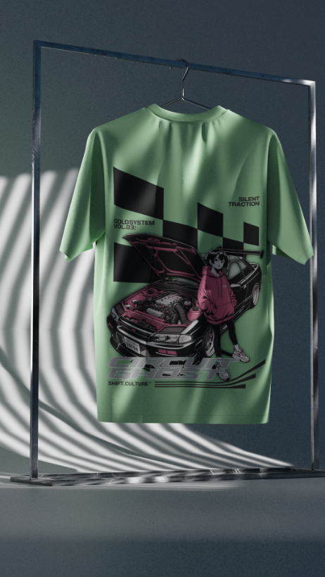 Green t-shirt with graphic design on a hanger against a dark background